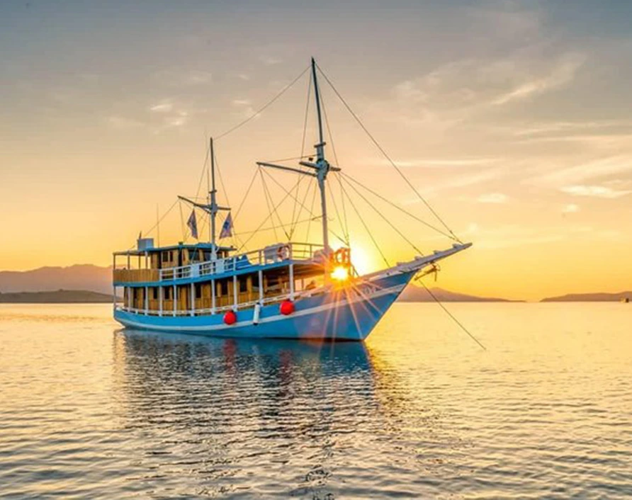 Standard boat for Komodo Private Cruise from Labuan Bajo with comfortable cabins and dining area
